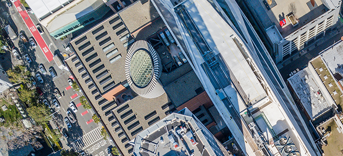 An aerial birds eye  view of San Francisco looking straight down at the skyscrapers and streets in the financial district.